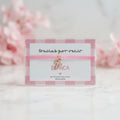 Pulsera cruz rosa para invitados de boda